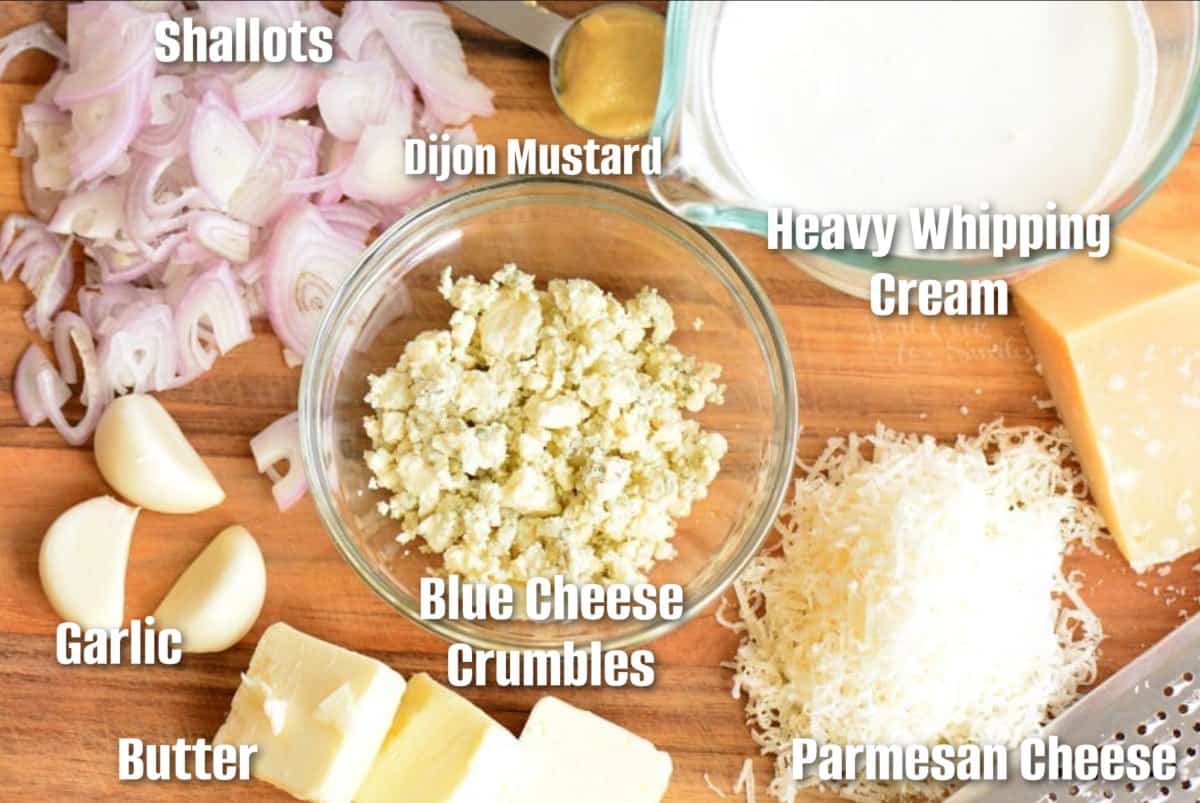 labeled ingredients for making creamy steak sauce on the cutting board.