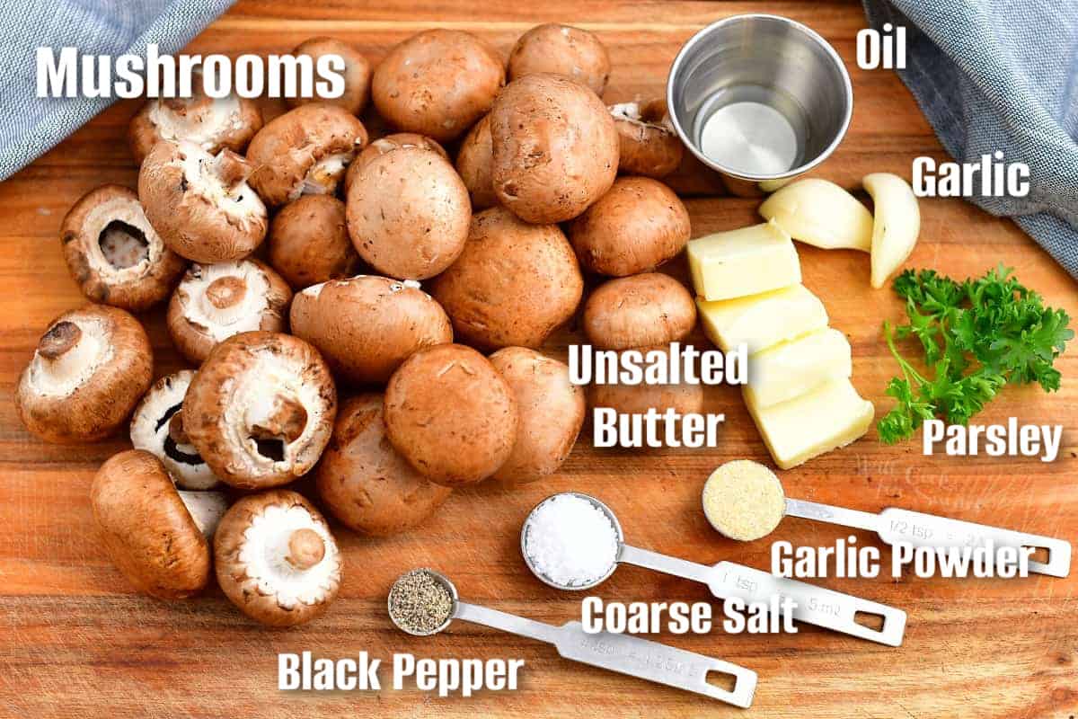 labeled ingredients to make sauteed mushrooms on the cutting board.