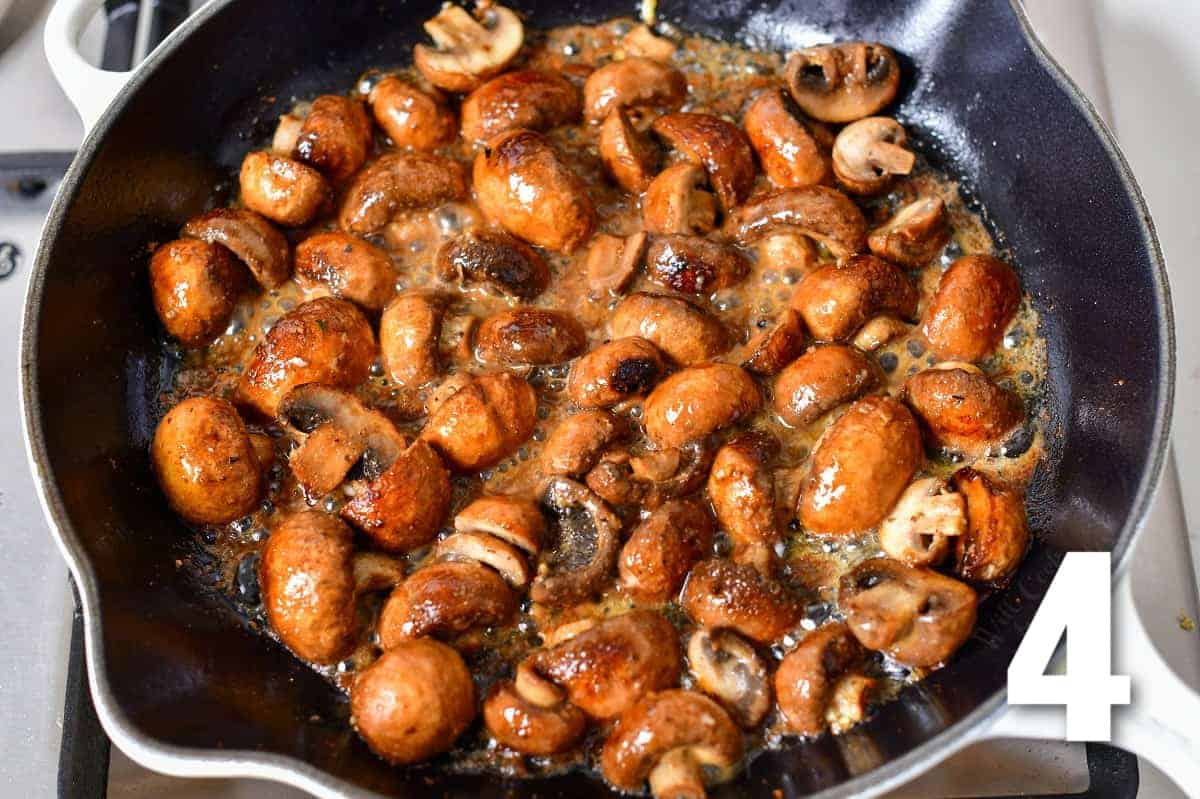 mushrooms sautéing in butter in the skillet.