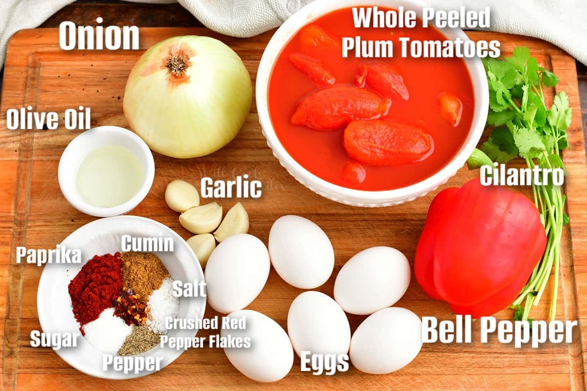labeled ingredients to make shakshuka on the cutting board.