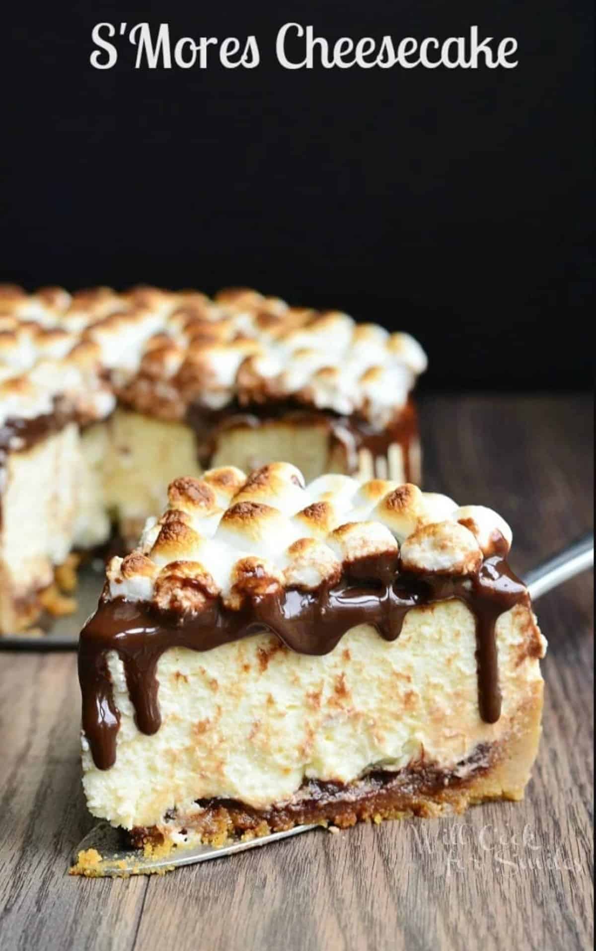slice of smores cheesecake on a pie serving spatula and cheesecake behind.