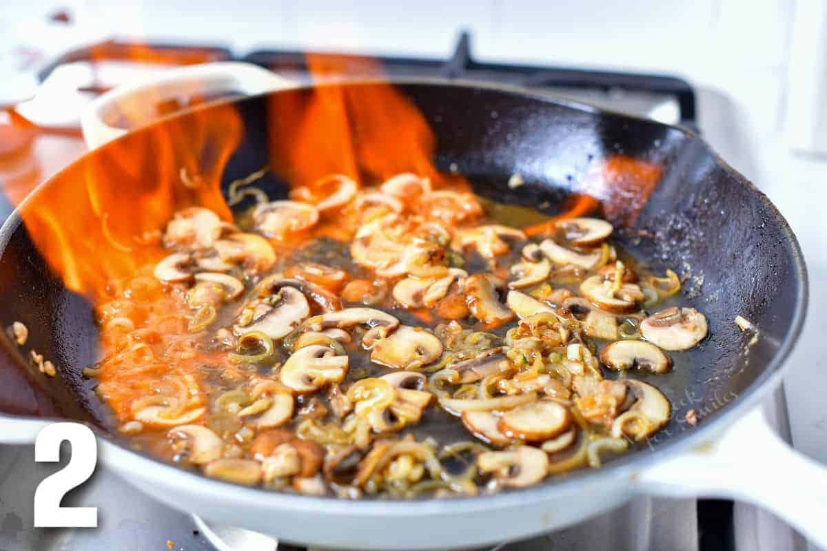 flambe technique: cognac set on fire in the skillet with mushrooms.