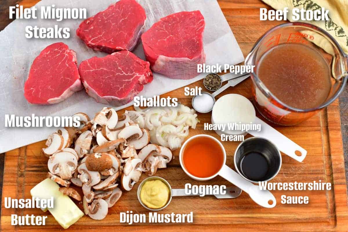 labeled ingredients for making steak Diane on a cutting board.