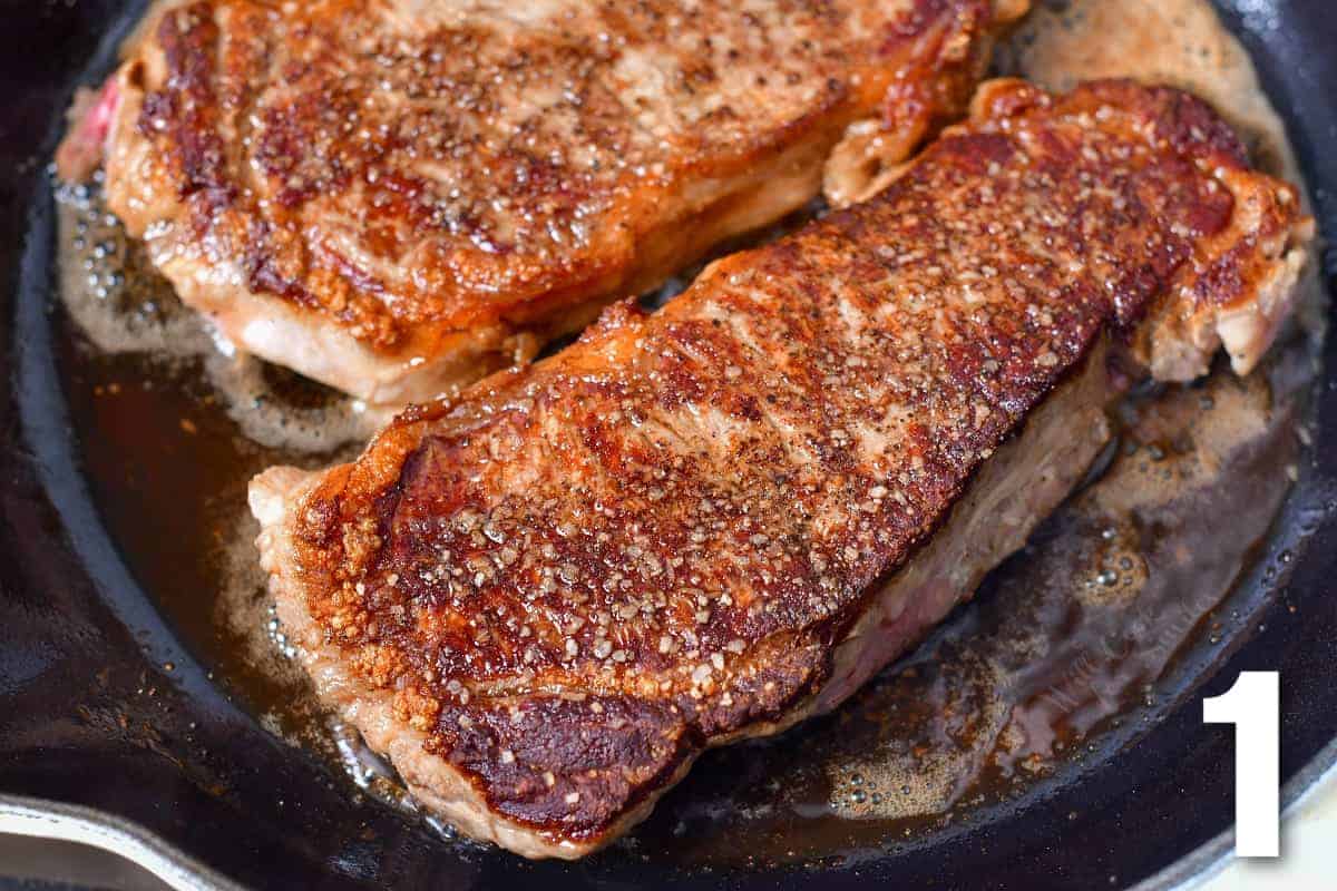 two seared top sirloin steaks in a cast iron skillet.