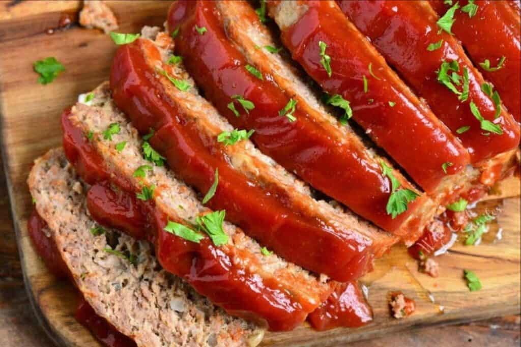 sliced meatloaf top on the cutting board.