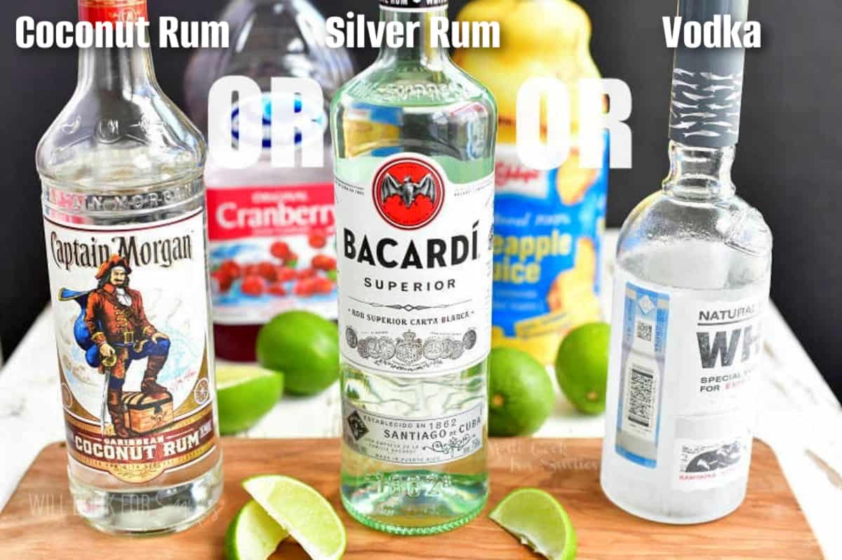 three bottles of clear liquors: coconut rum, white rim, and vodka.