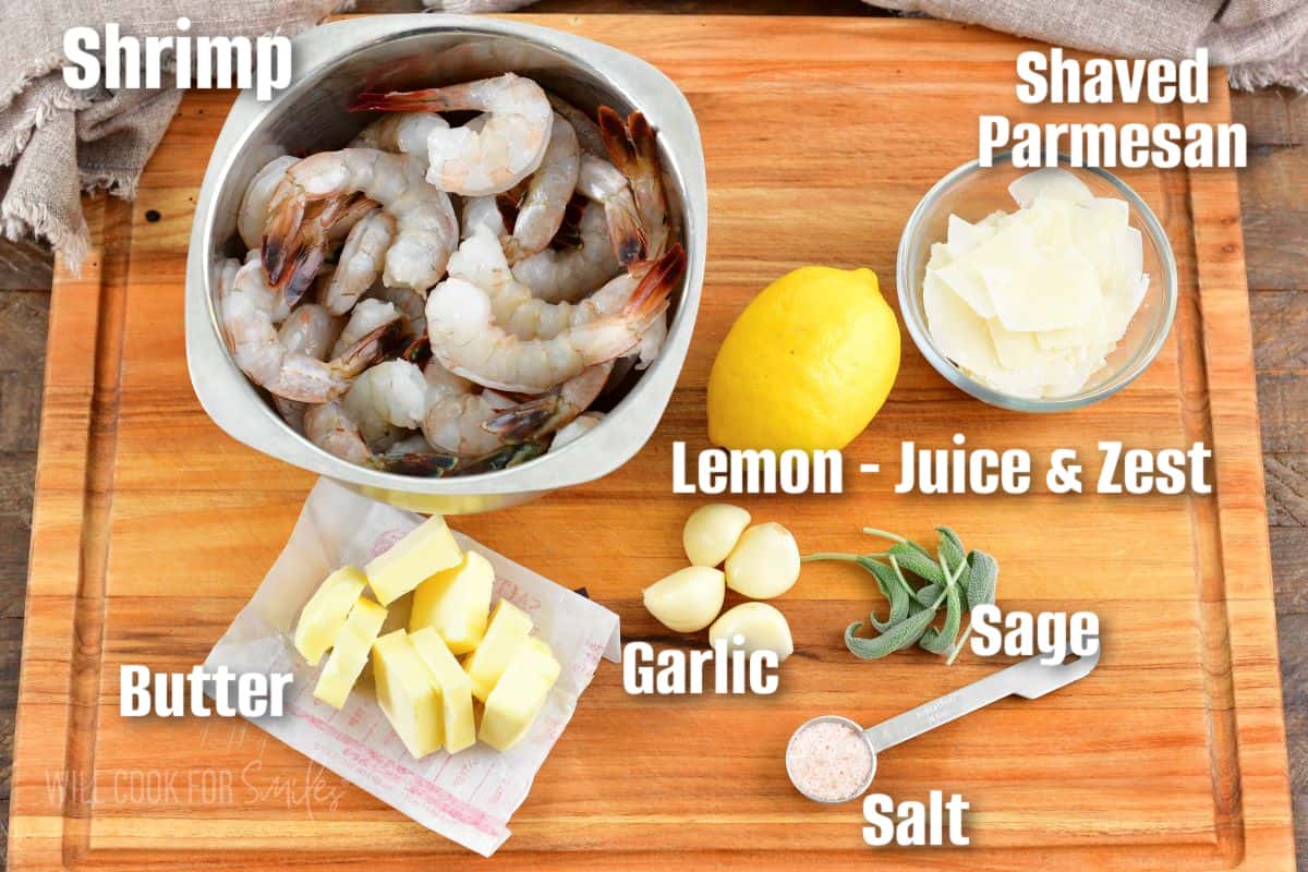 labeled ingredients to make garlic butter shrimp on cutting board.