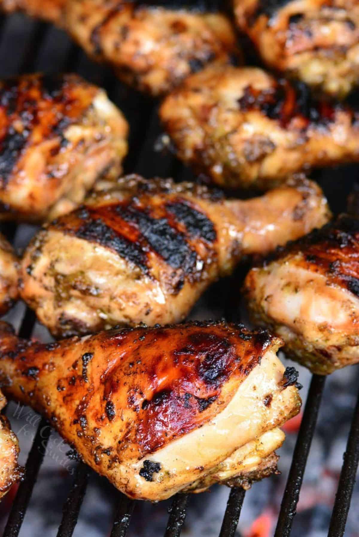 marinated chicken drumstick cooking on the grill.