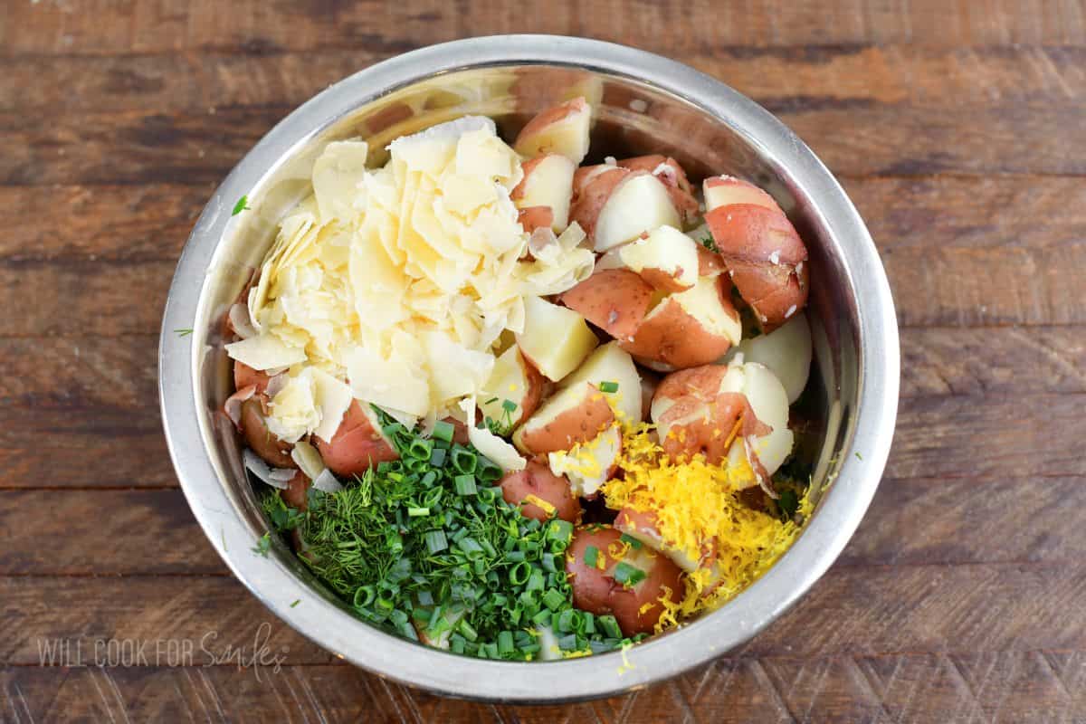 ingredients for the potato salad in a mixing bowl before mixing.