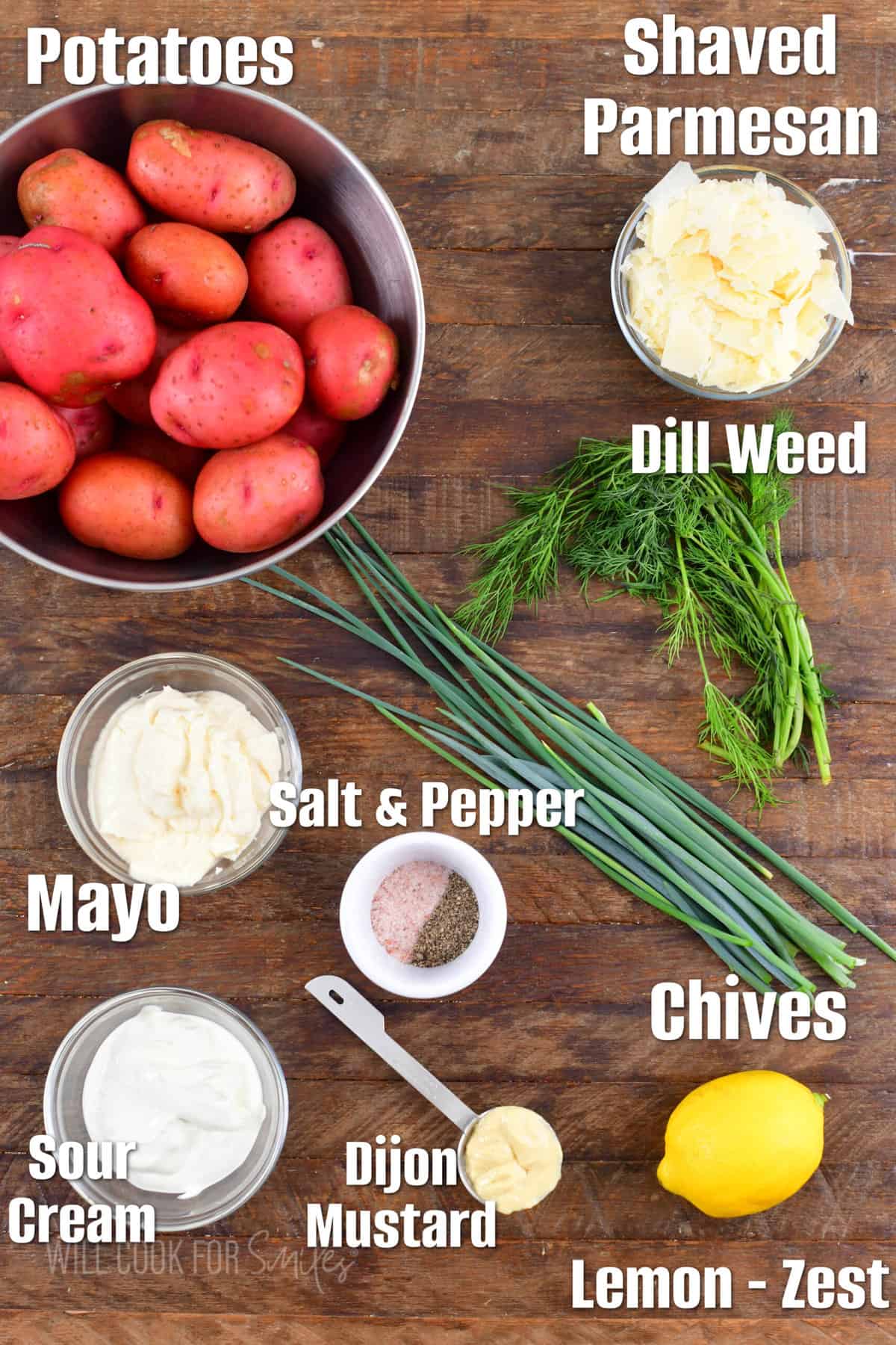 ingredients to make parmesan dill potato salad on a wooden background.