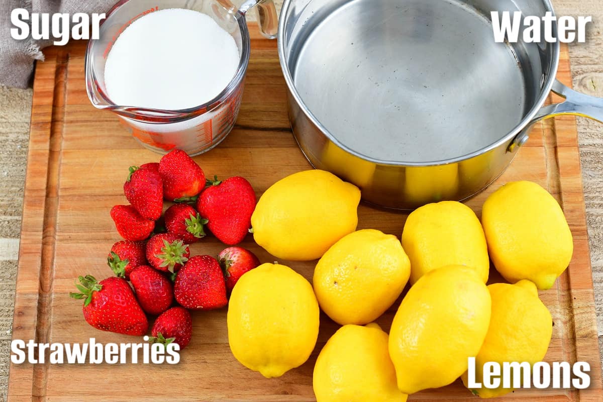 labeled ingredients to make pink lemonade on the cutting board.