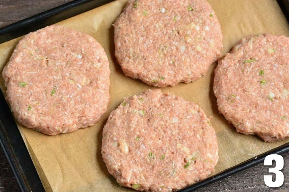 four shaped turkey burger patties before cooking.