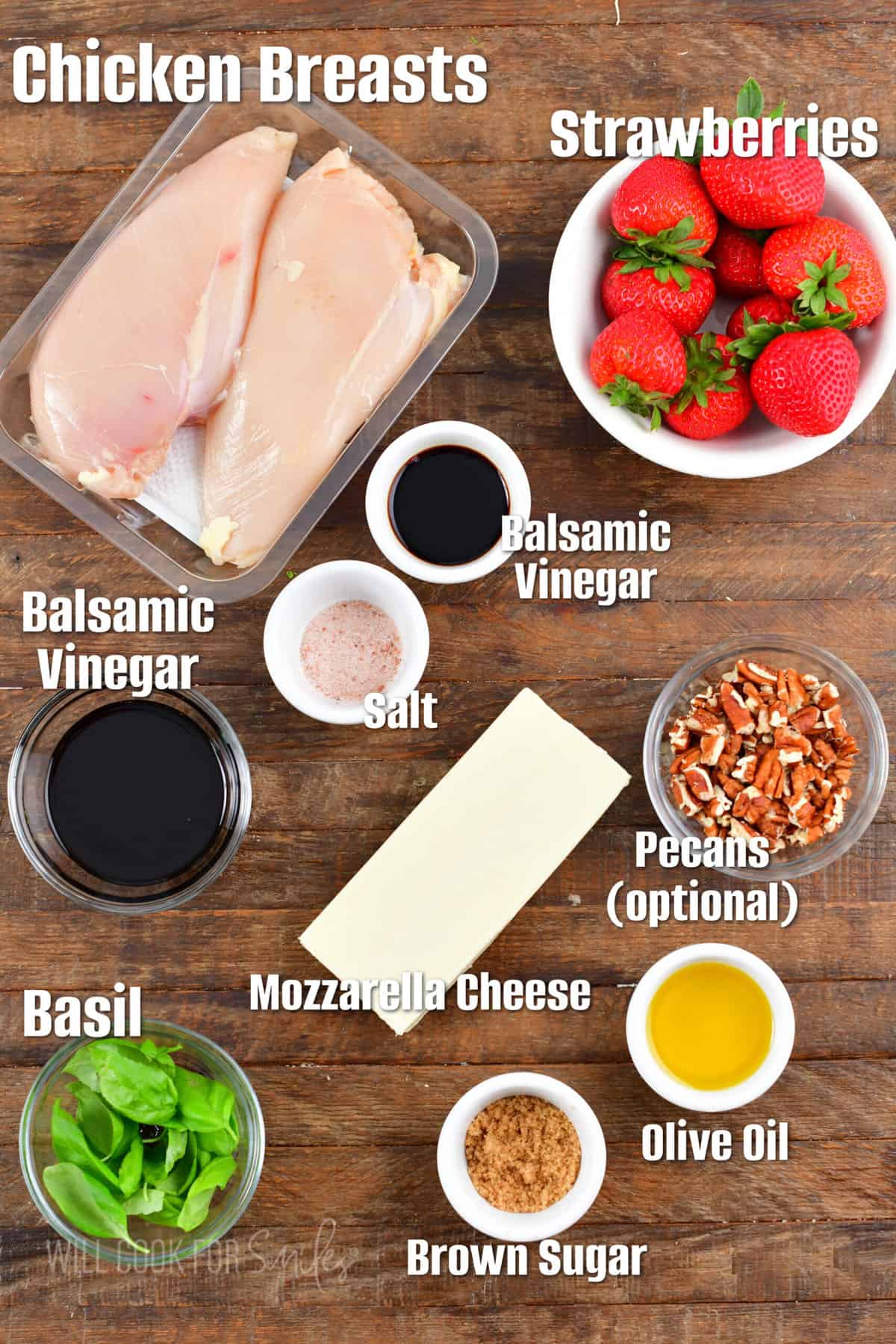 labeled ingredients to make balsamic chicken salad on wooden background. 