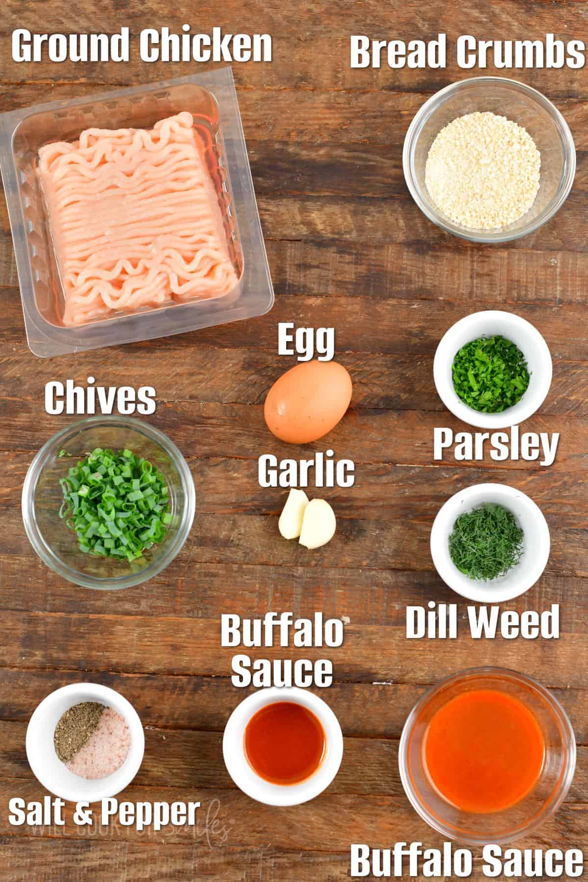 The ingredients for buffalo chicken burgers are placed on a wooden surface. 