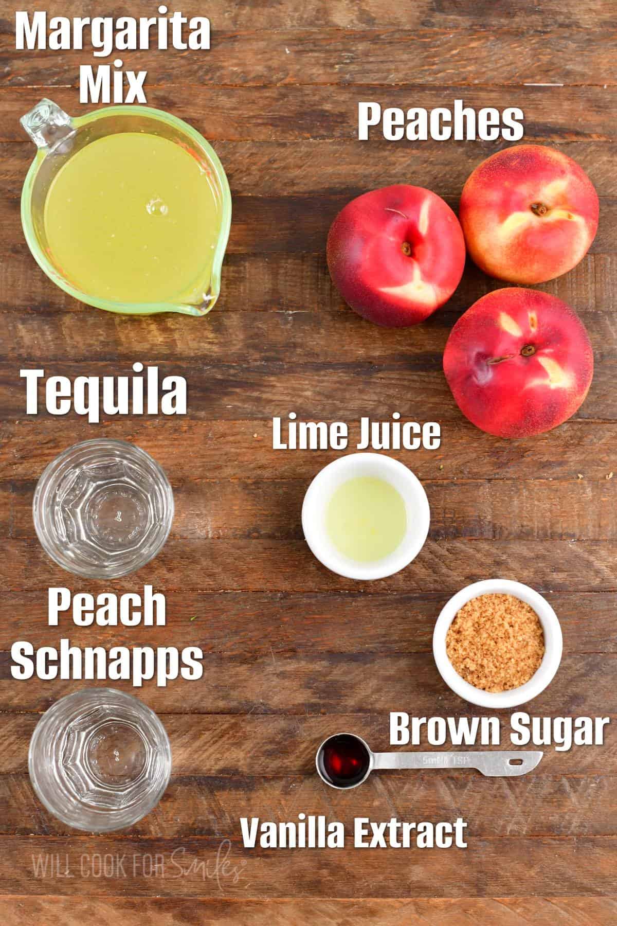 The ingredients for peach margarita are placed on a wooden surface. 