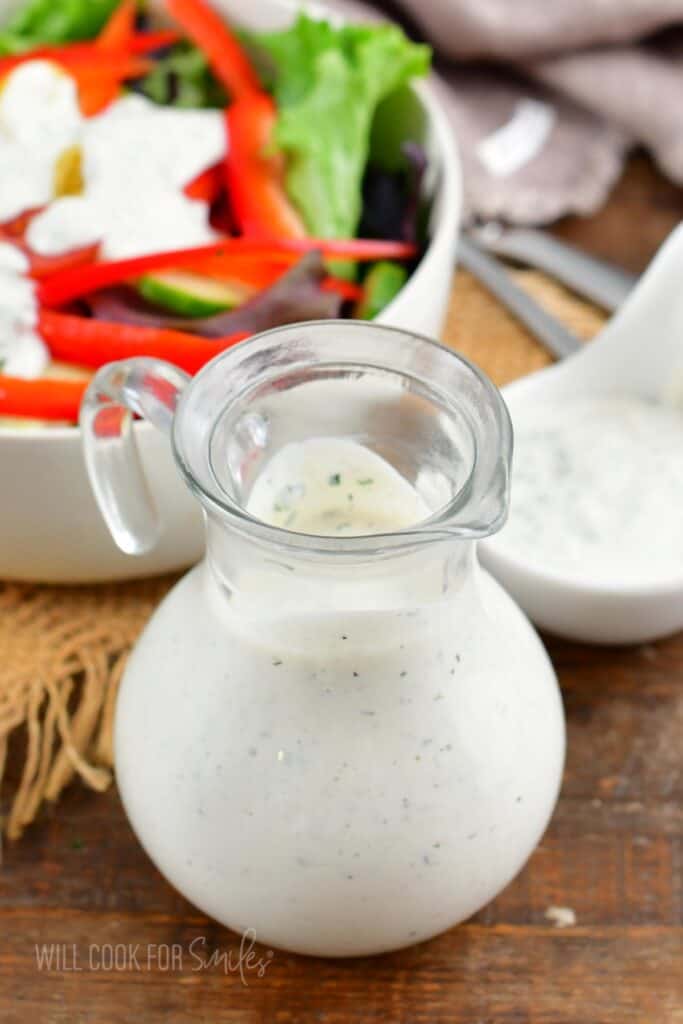 creamy buttermilk ranch dressing in a glass dressing jar.