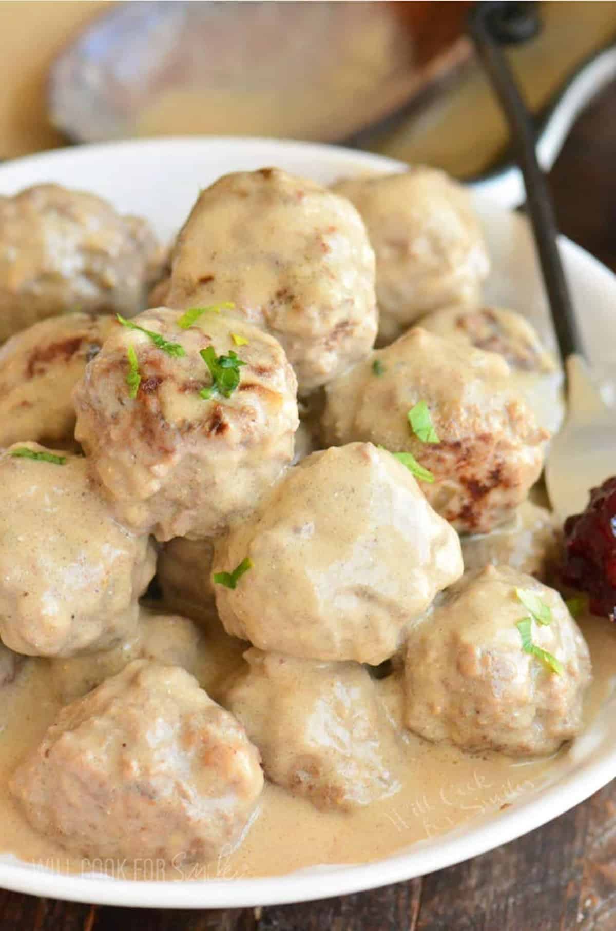 A mount of Swedish meatballs are smothered with creamy gravy. 