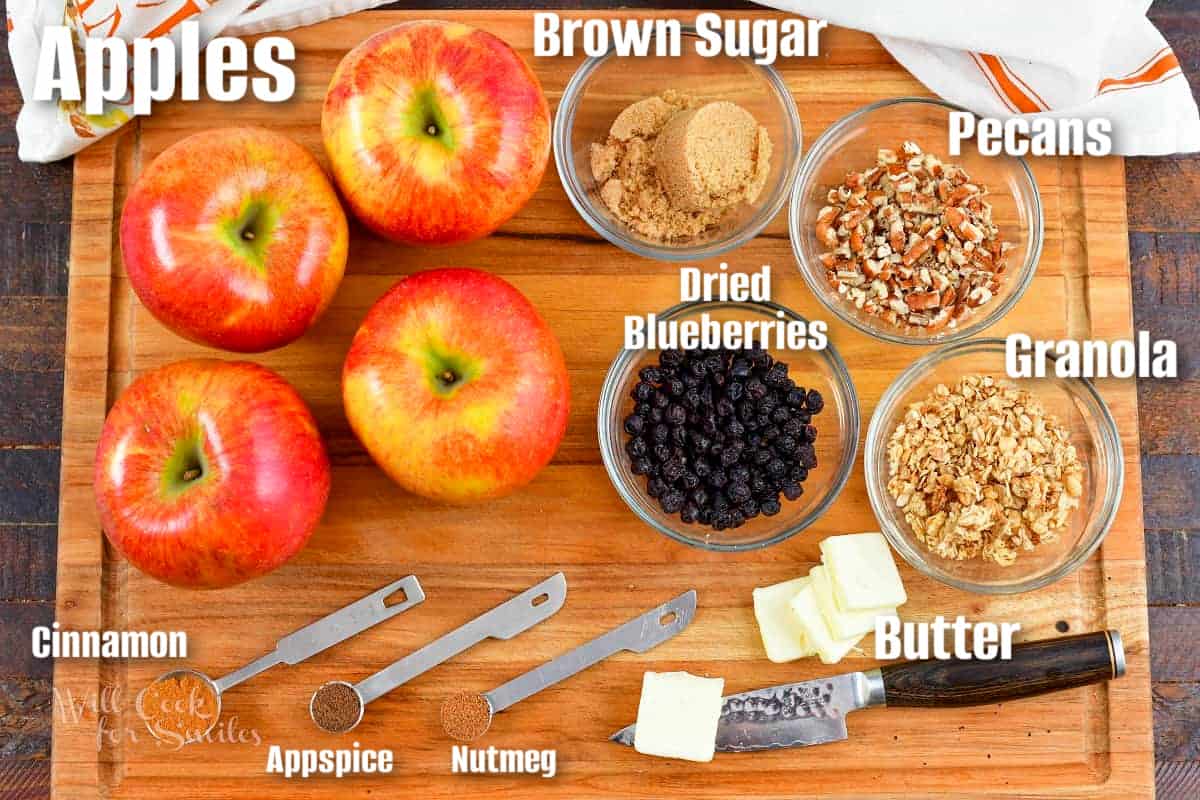 labeled ingredients to make baked apples on the cutting board.