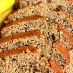 banana bread cut into slices on a table.