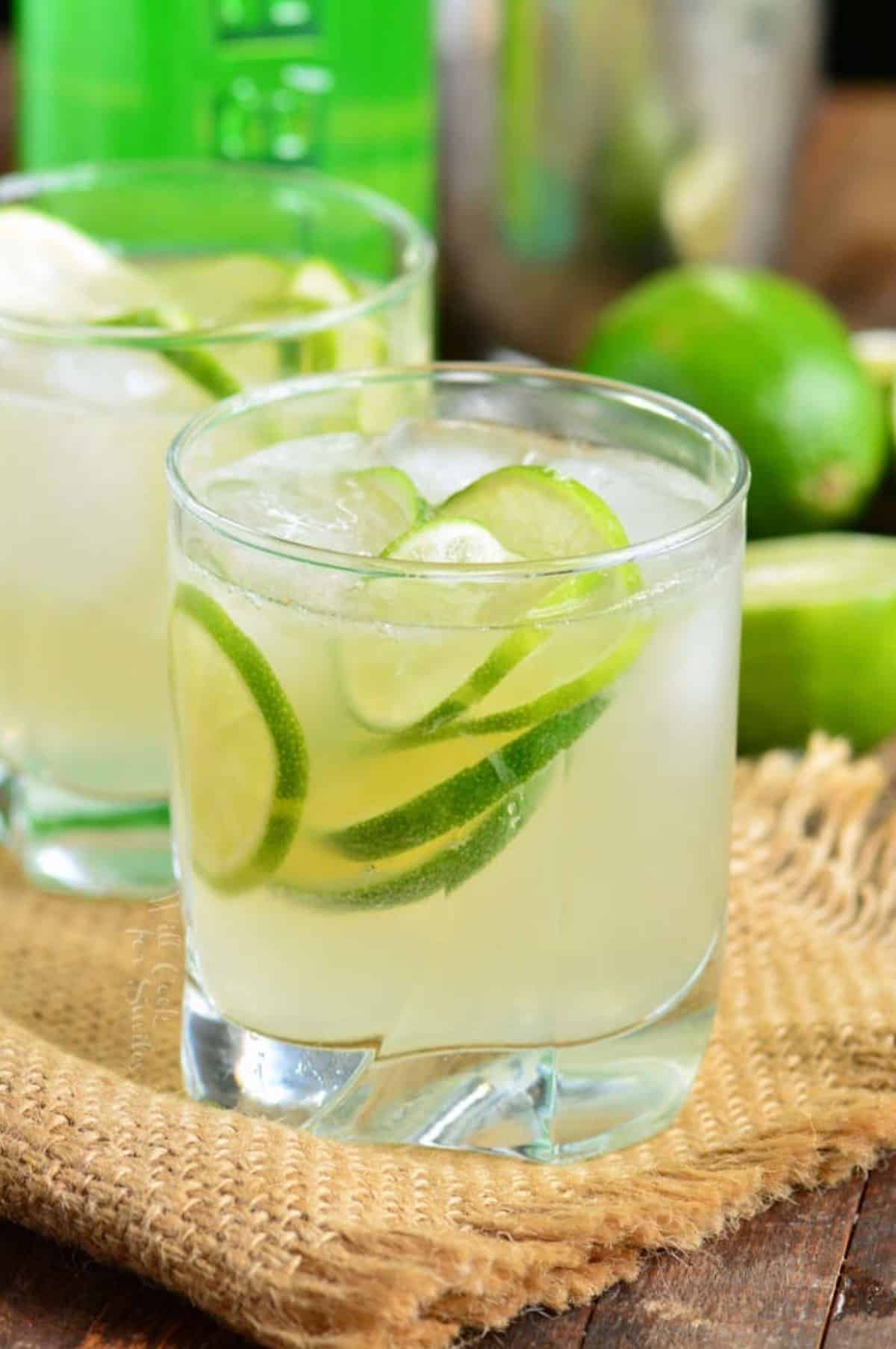 caipirinha in a short glass with ice and lemons.