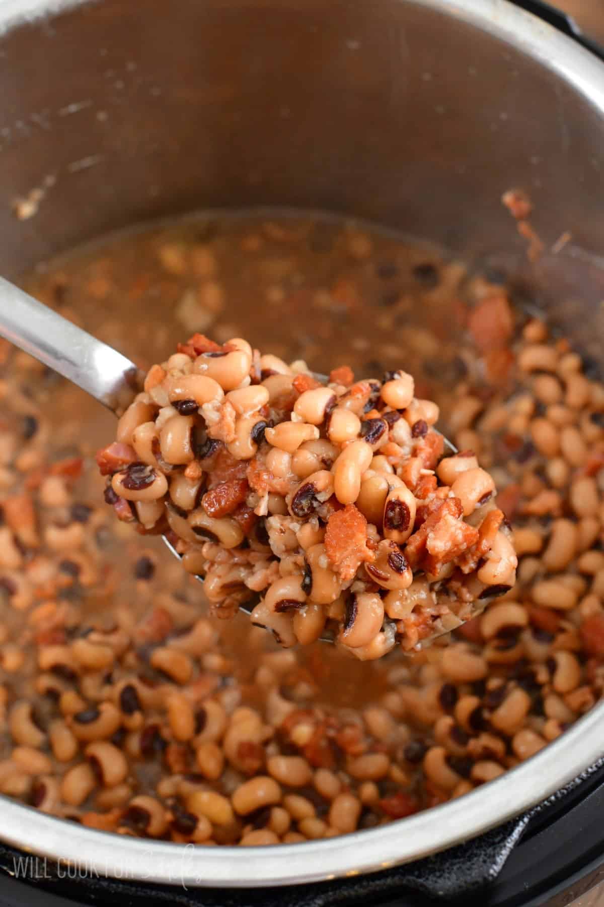 Big spoon with a scoop of black eye peas from the instant pot.