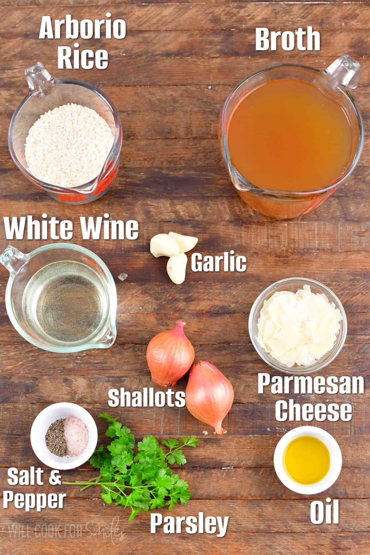 Labeled ingredients to make parmesan risotto on a wood surface.
