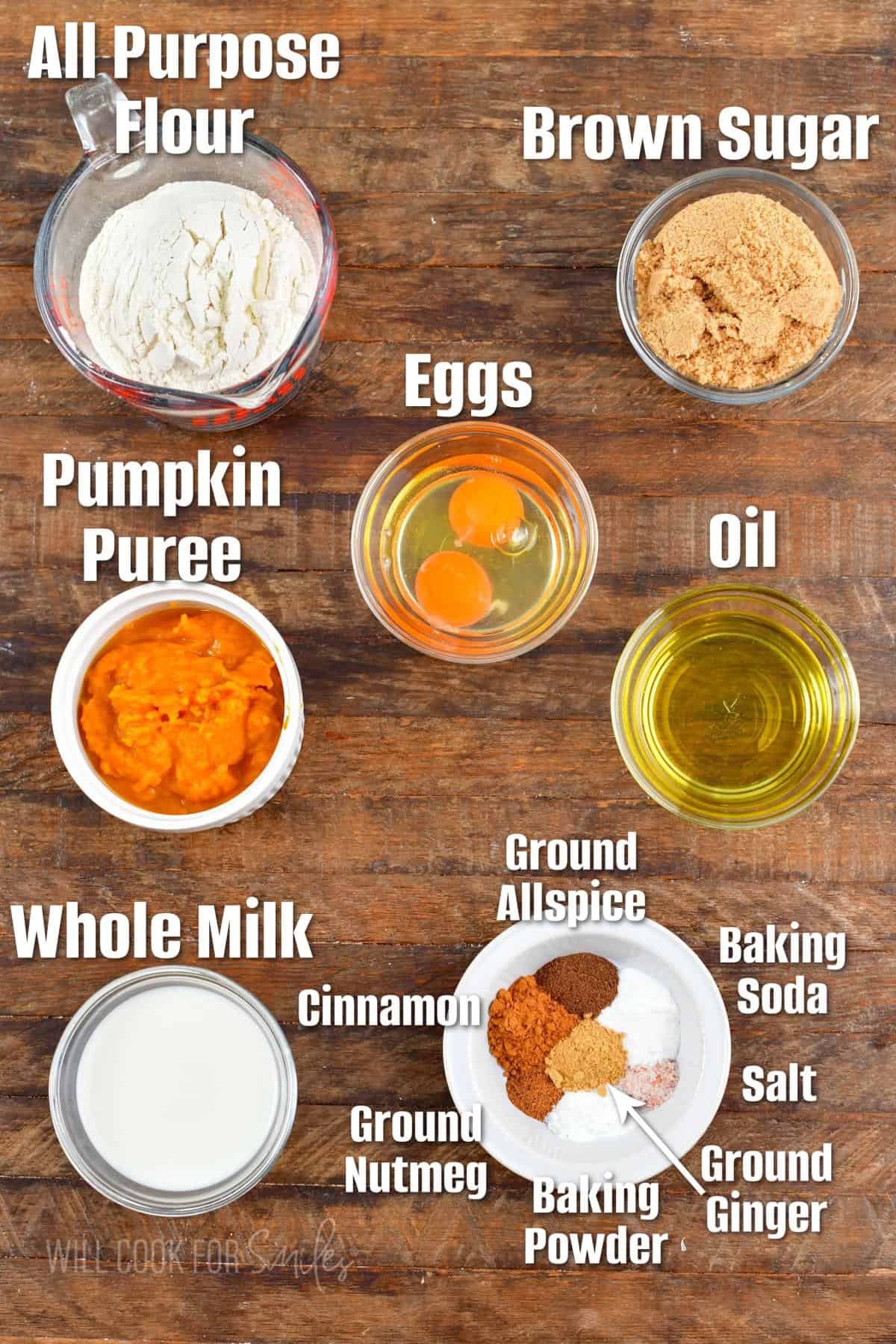 labeled ingredients to make the classic pumpkin bread in wooden board.