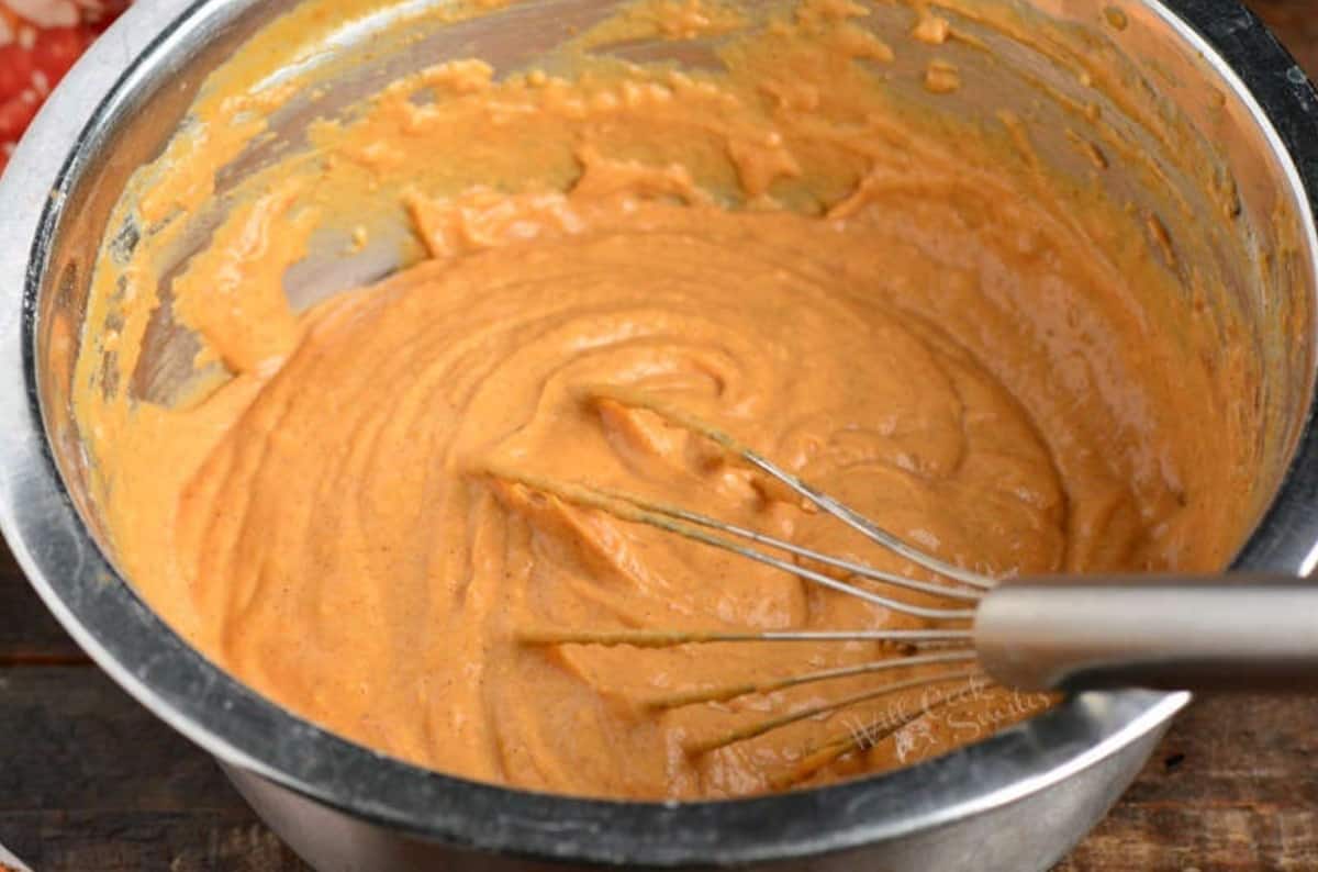 pumpkin pancake batter mixed up with a whisk.