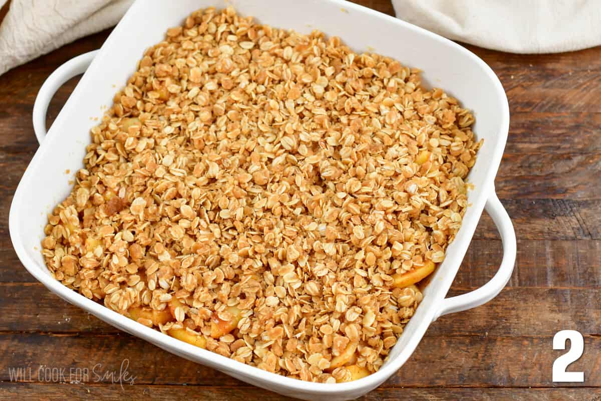 Apple Crisp in a baking dish with oats on top.