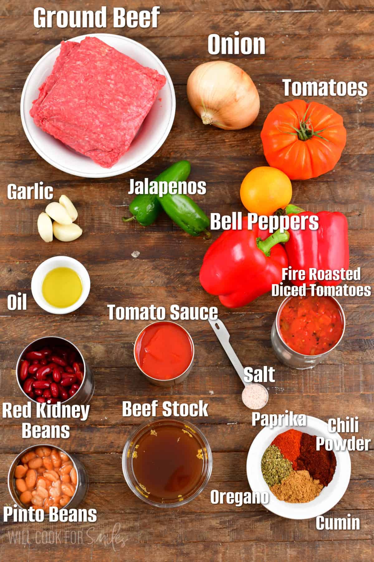 labeled ingredients for chili on a wood surface.