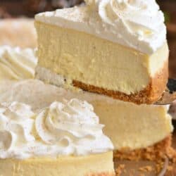 eggnog cheesecake with a slice being pulled out.