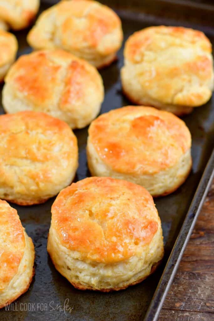honey butter biscuits on a baking sheet.