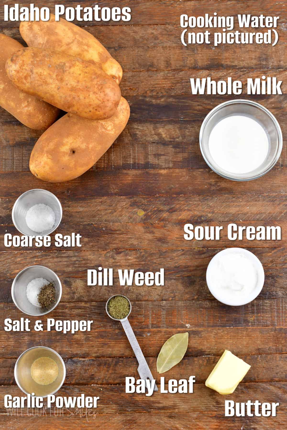 labeled ingredients to make classic mashed potatoes on a wooden board.