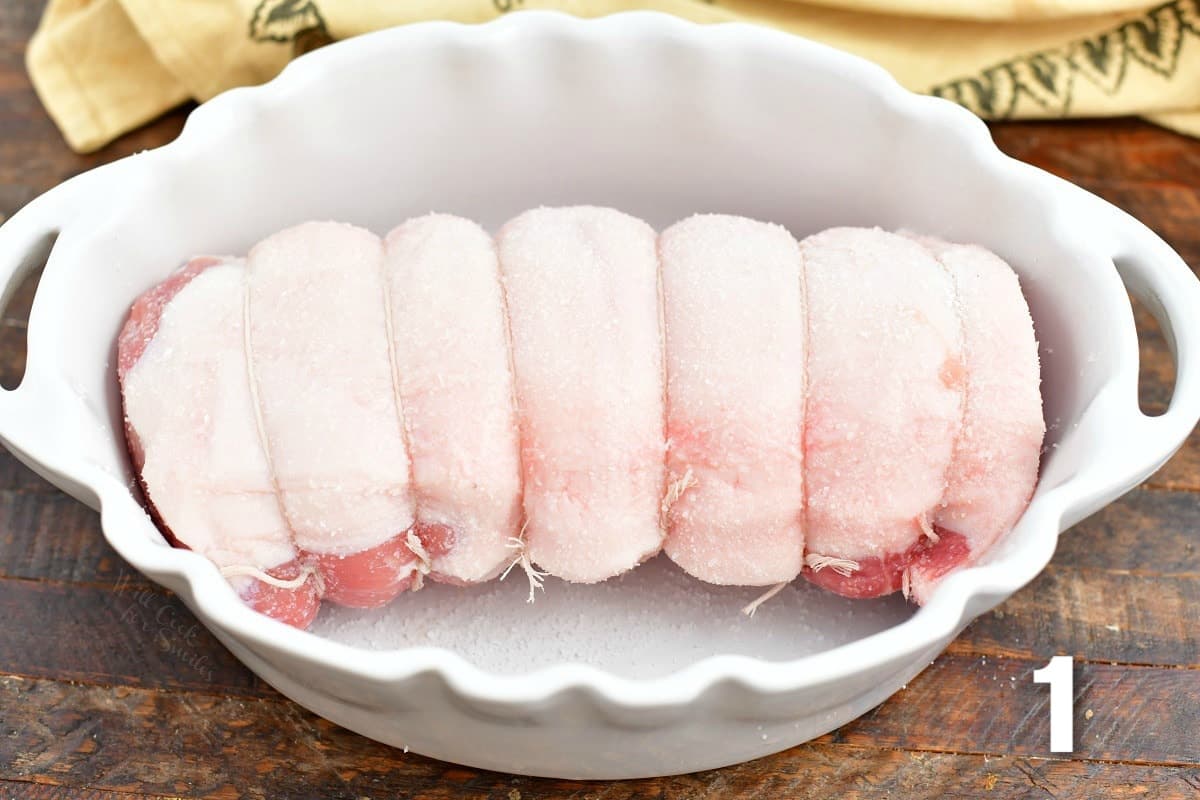 tied and salted pork loin in the casserole dish.