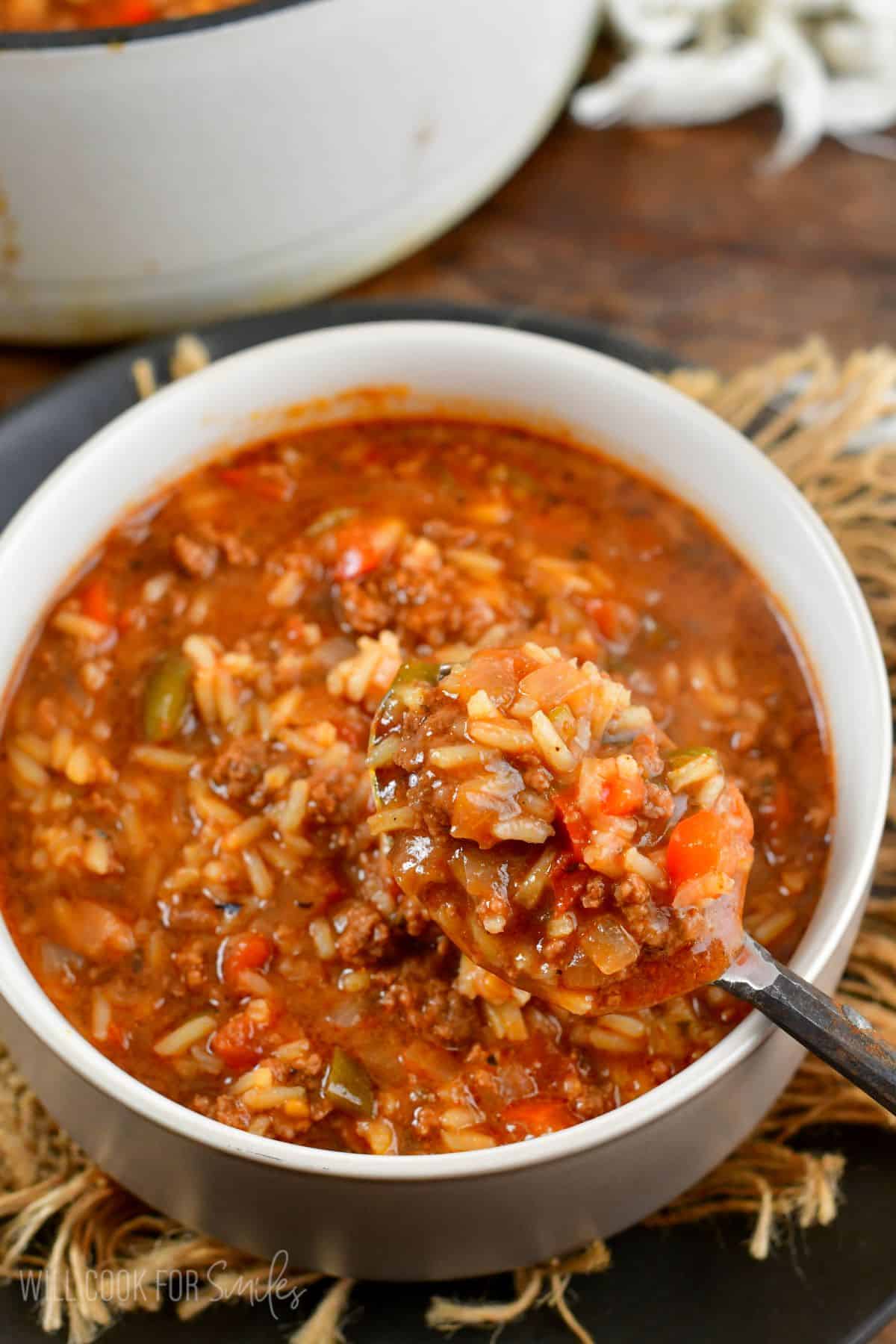 stuffed pepper soup scooping some out with a spoon.