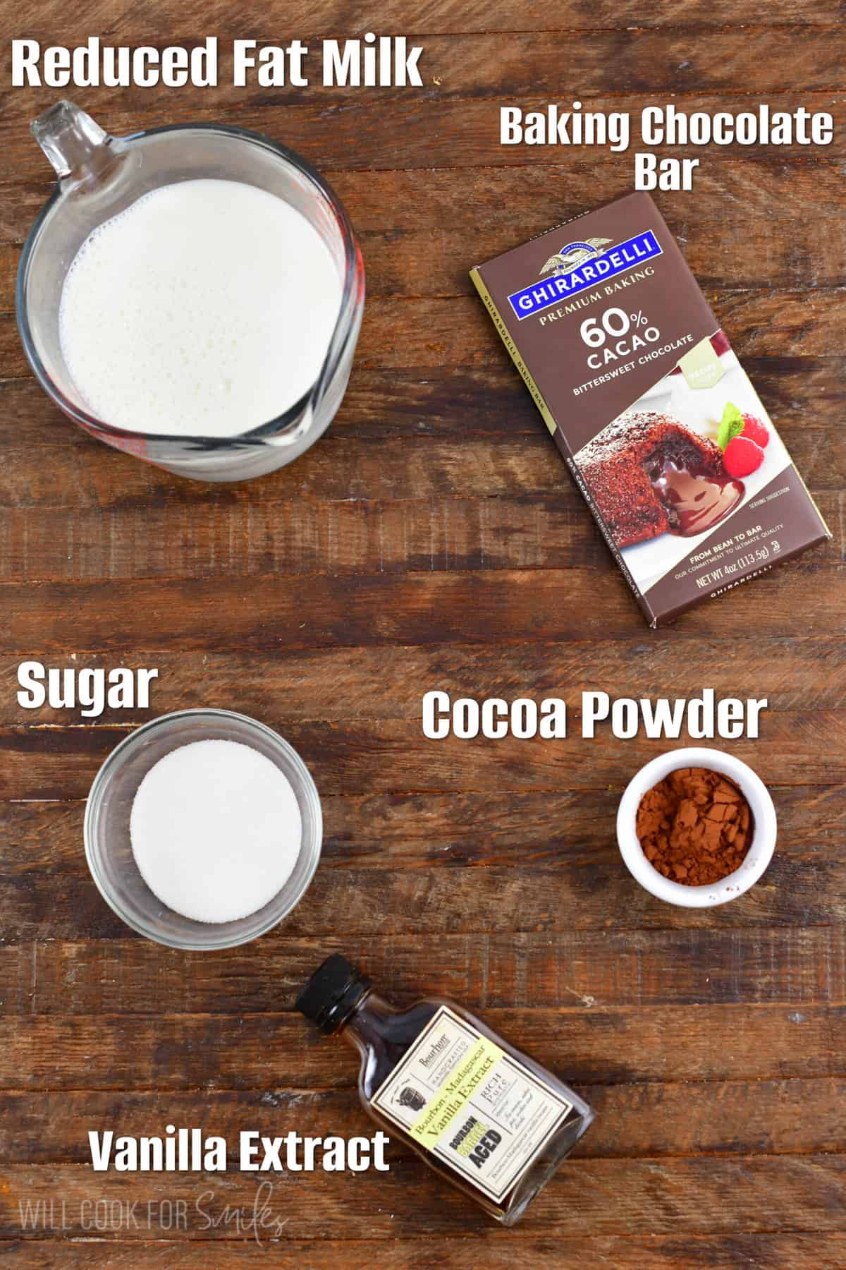 labeled ingredients for hot chocolate on a wood surface.