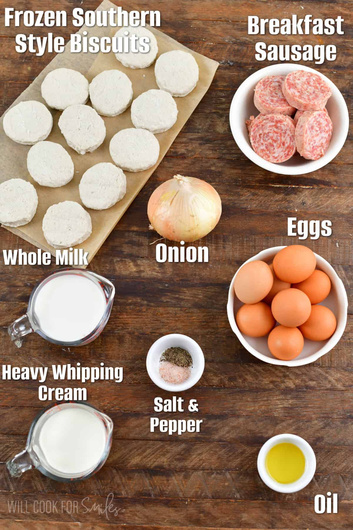 Labeled ingredients for sausage biscuits on a wood surface.