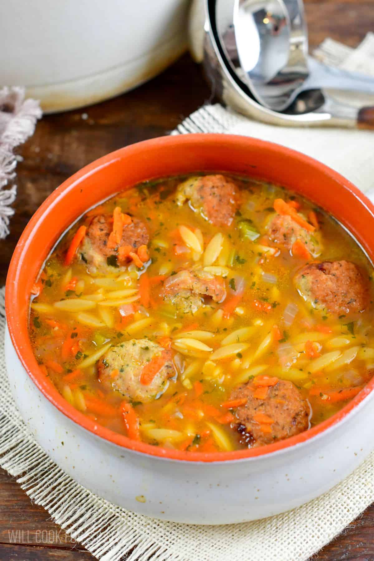 bowl of chicken meatball and orzo soup.