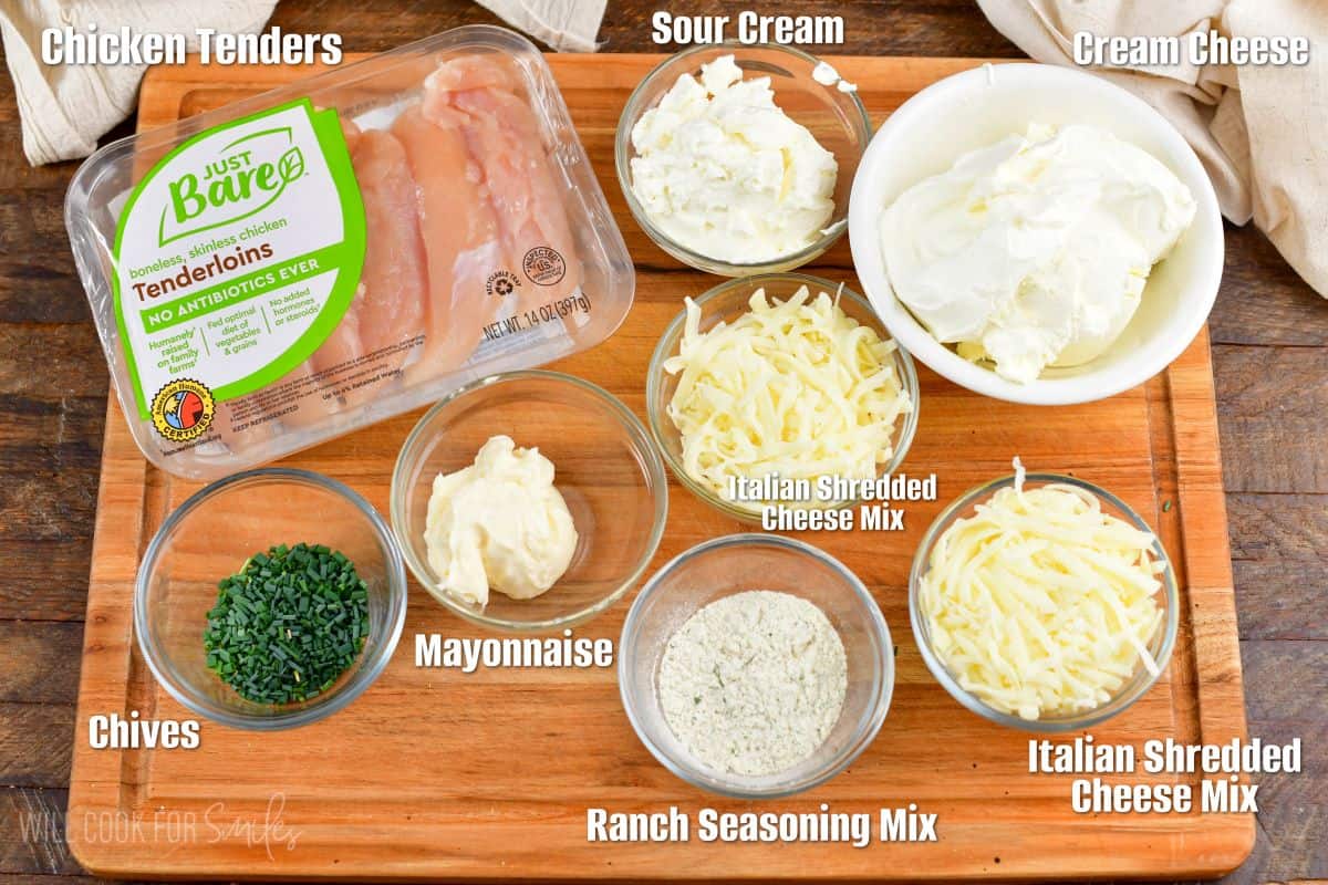 labeled ingredients to make chicken ranch dip on a cutting board.