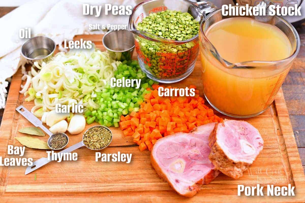 labeled ingredients to make split pea soup on a wooden cutting board.