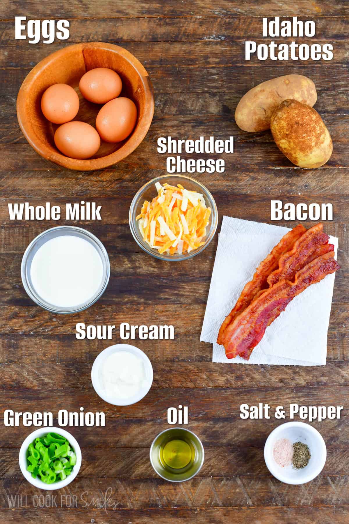 ingredients to make loaded potato breakfast skillet on a wooden background.