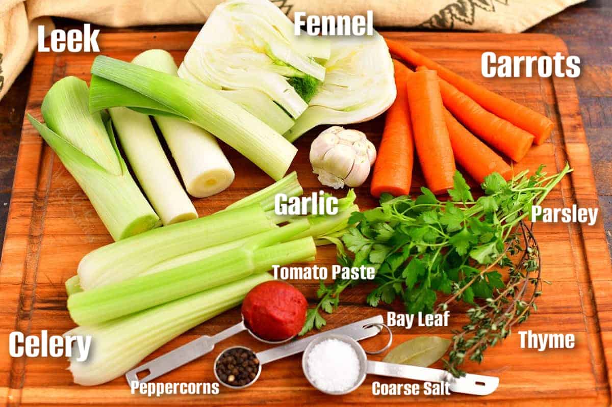 labeled ingredients to make vegetable stock on a wooden board.