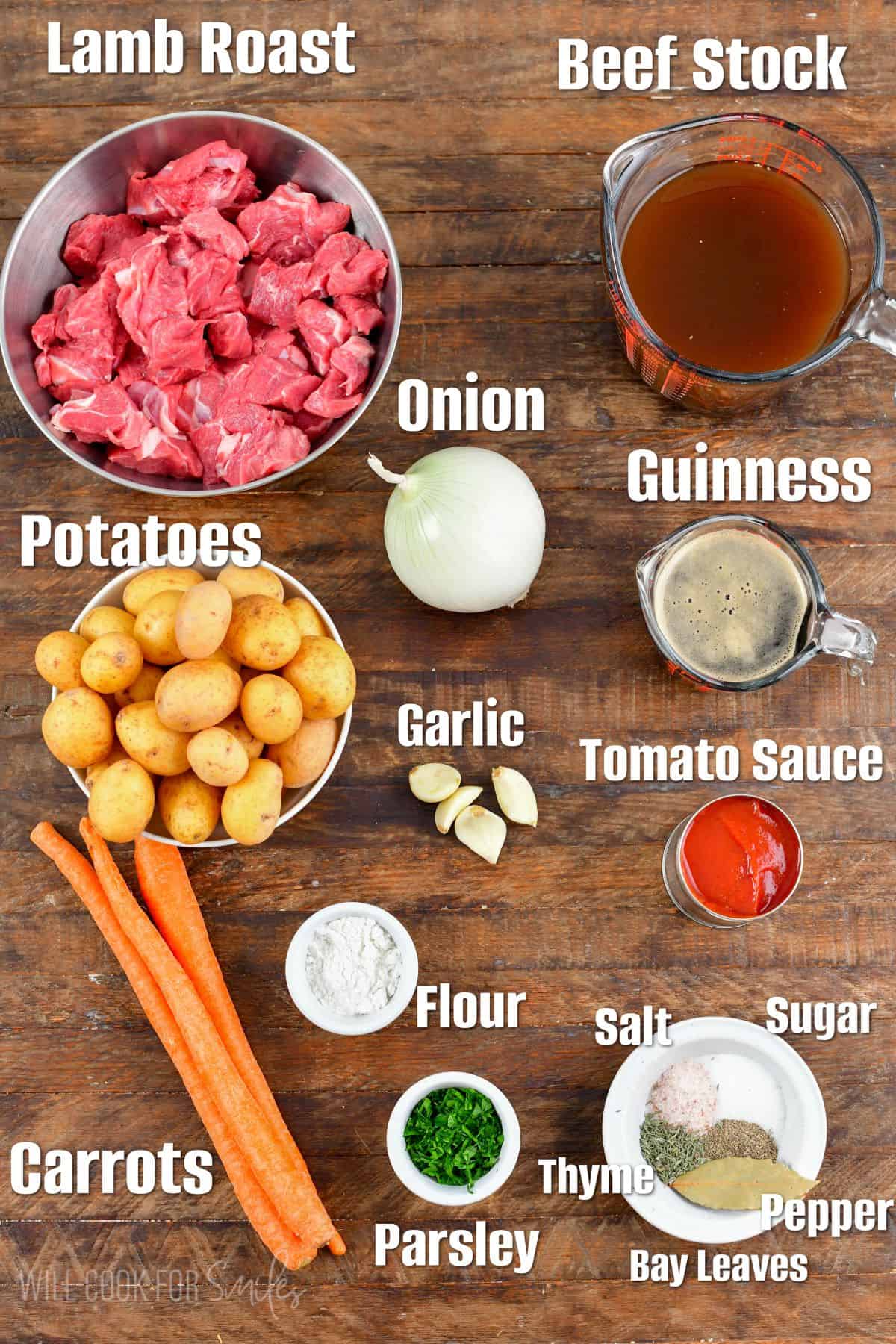 Labeled ingredients for Irish beef strew on a wood surface.