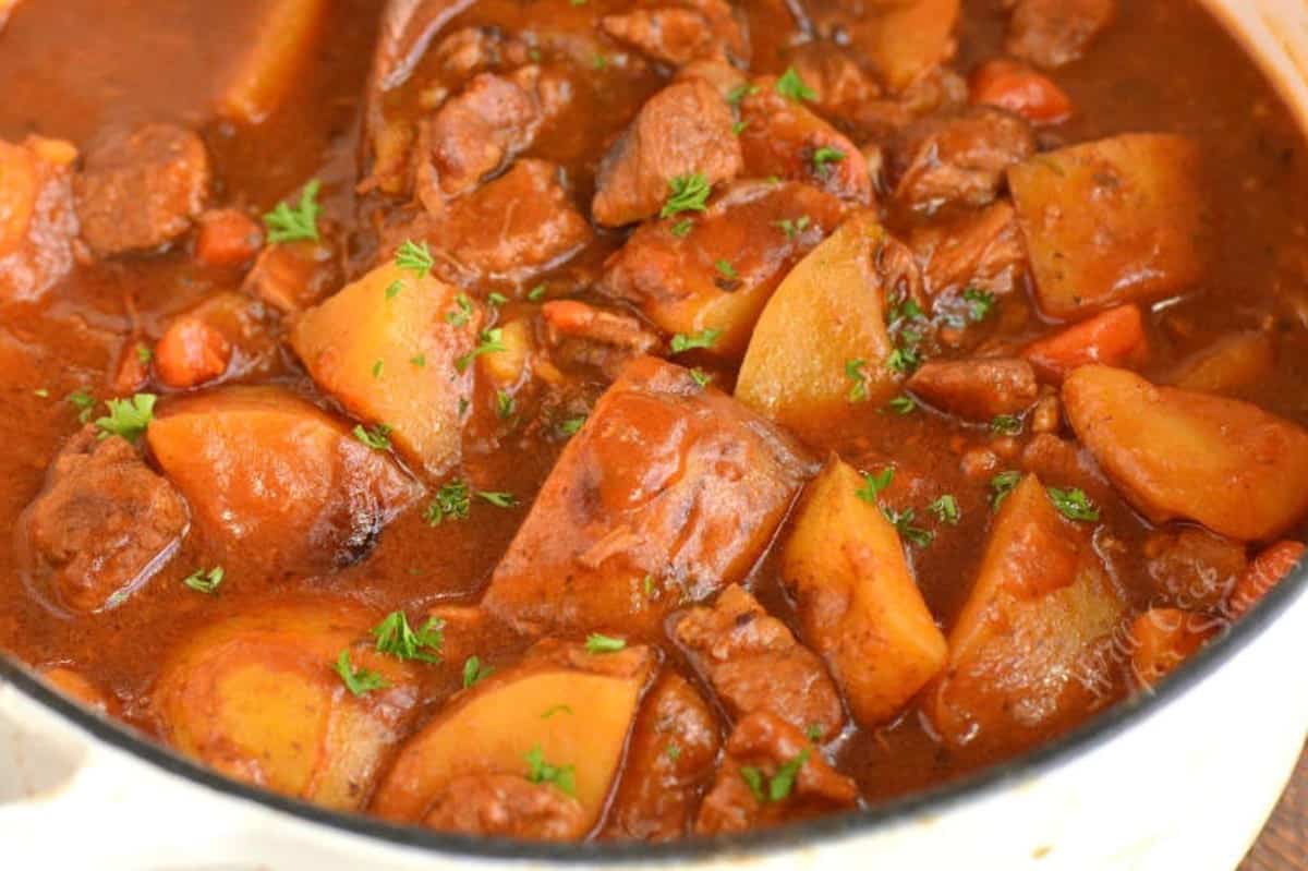 Irish beef stew in a pot with lamb and potatoes.