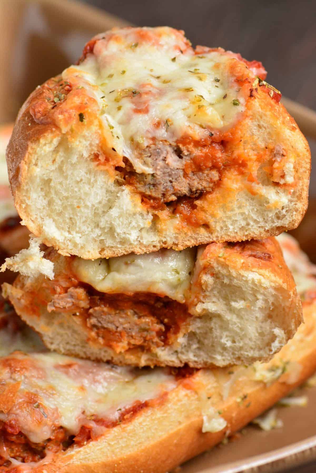 Meatball sub cut up and staked on top of one another.
