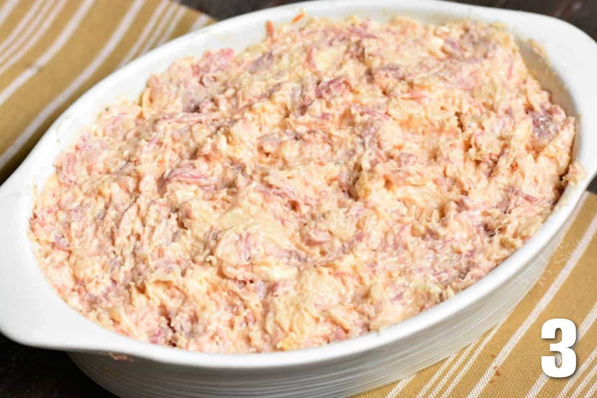 Rueben dip in a baking dish before cooking.