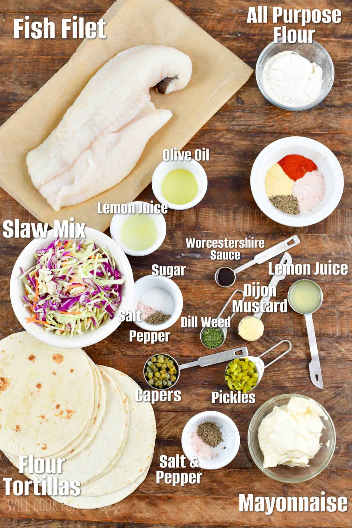 Labeled ingredients for Fried fish tacos on a wood surface.