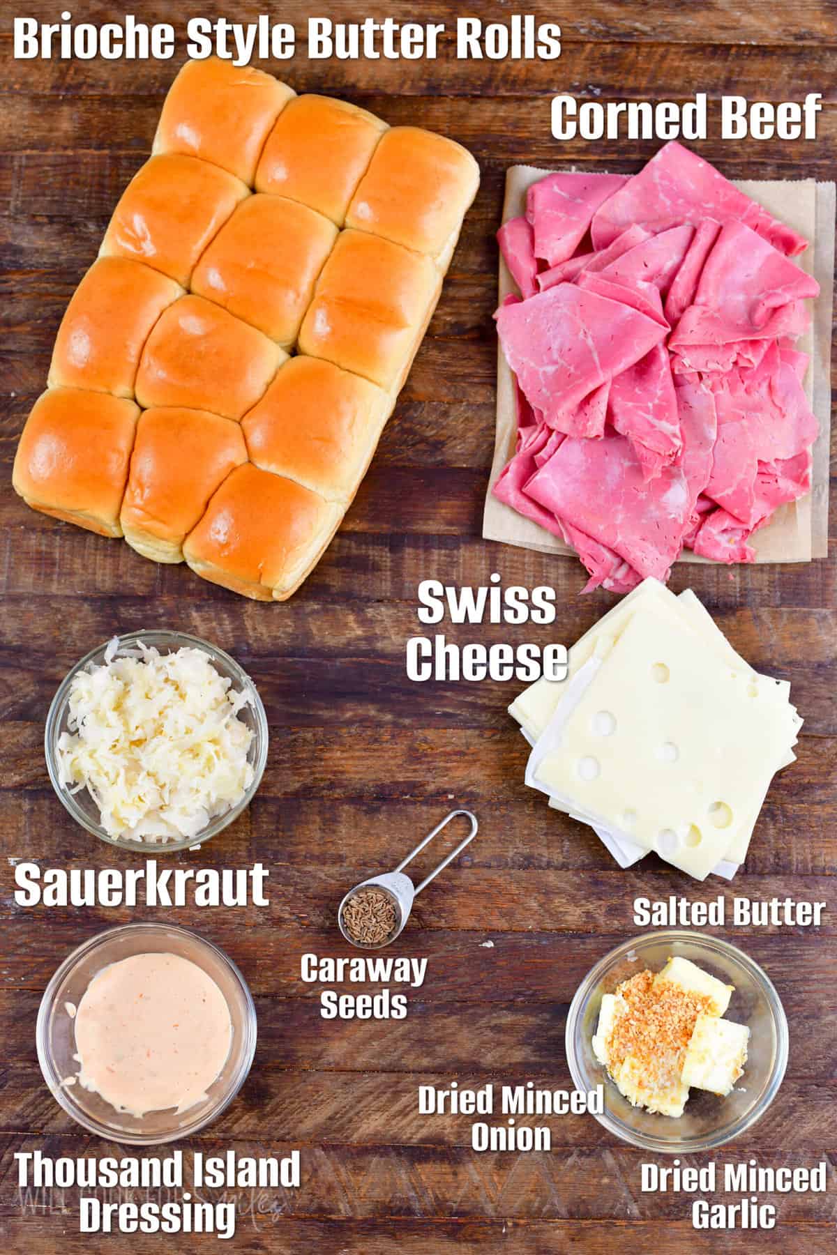 Labeled ingredients for Reuben sliders on a wood surface.