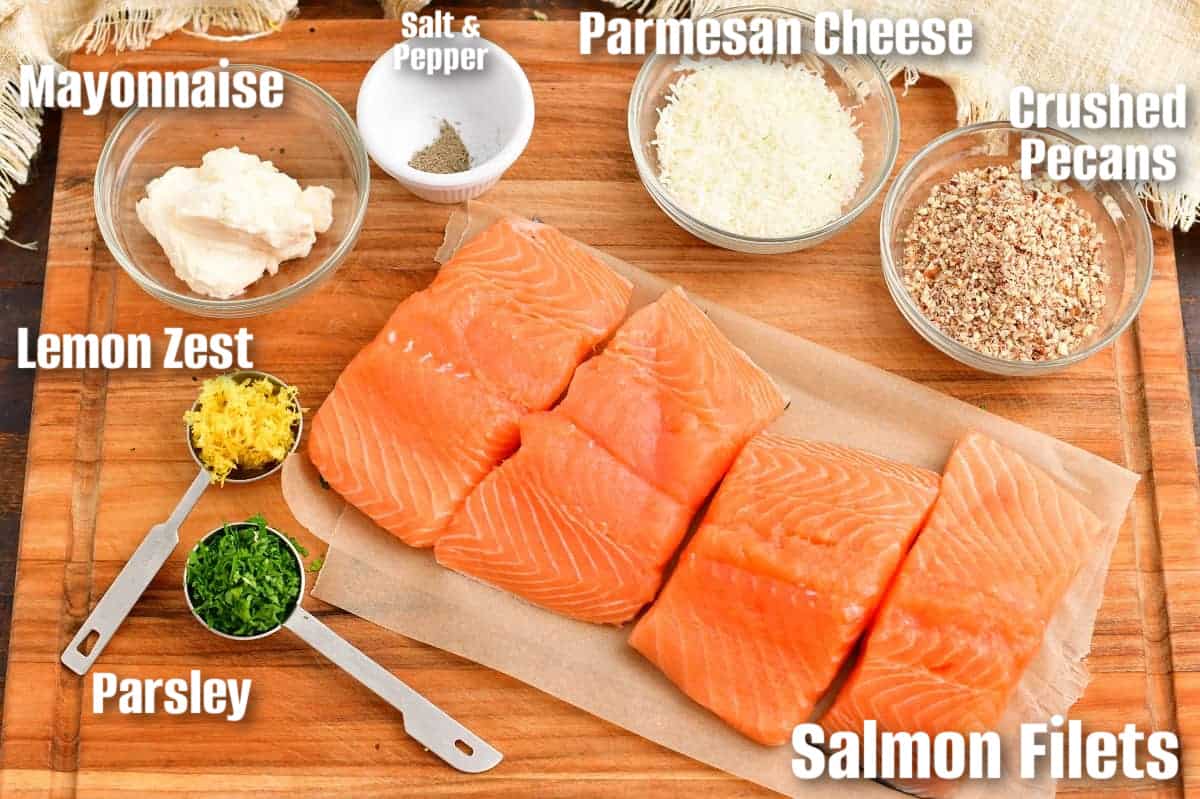 labeled ingredients to make pecan crusted salmon on the wooden board.