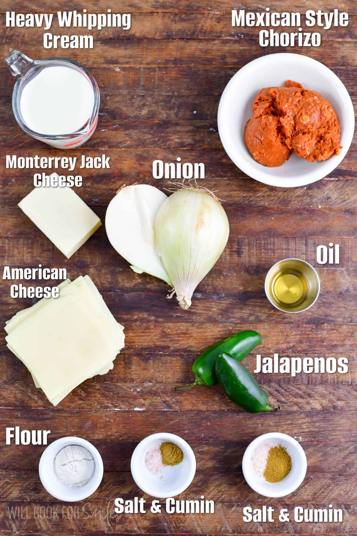 labeled ingredients to make white queso dip with chorizo on the wooden board.